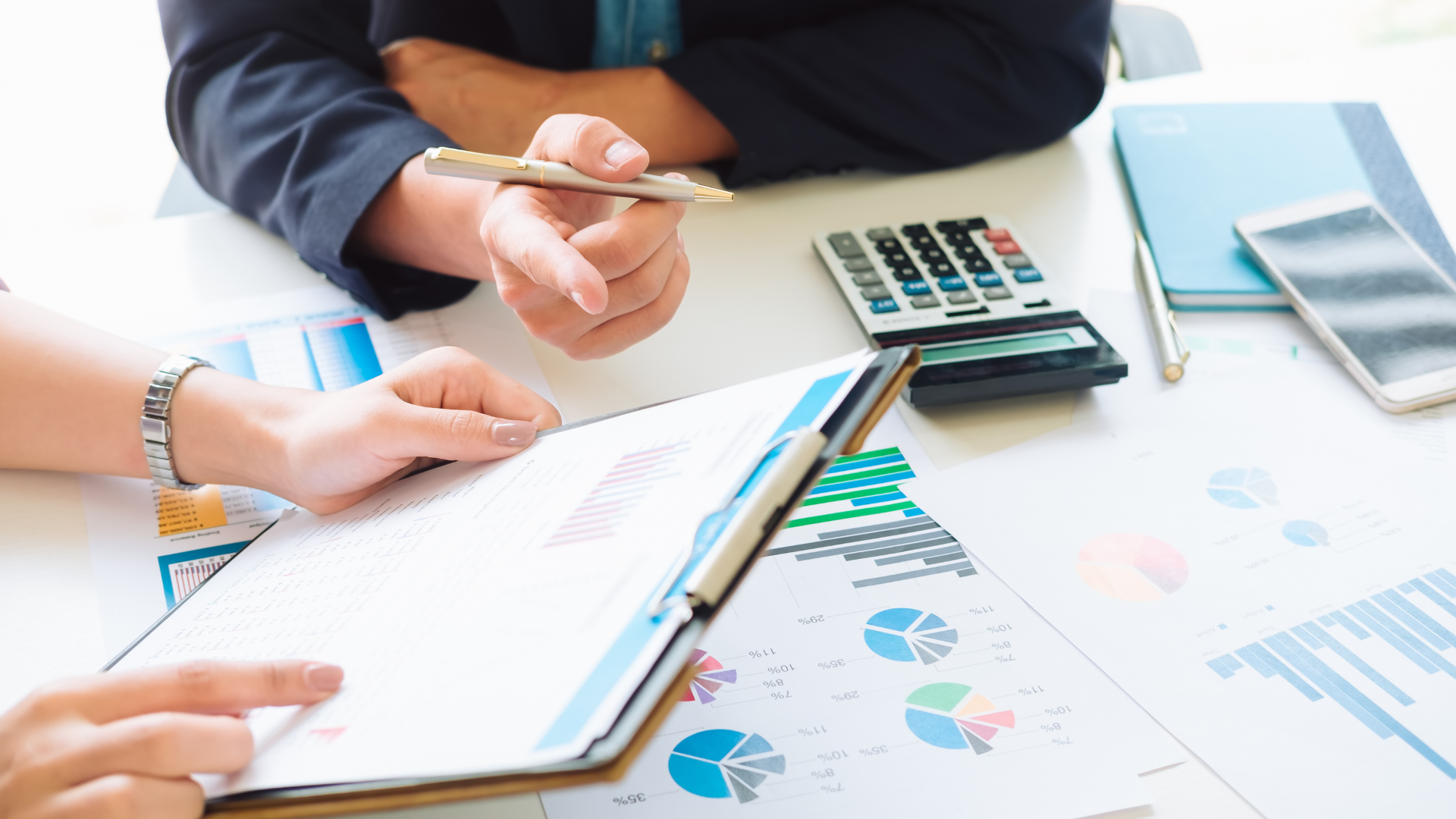 Business consultancy team reviewing data reports