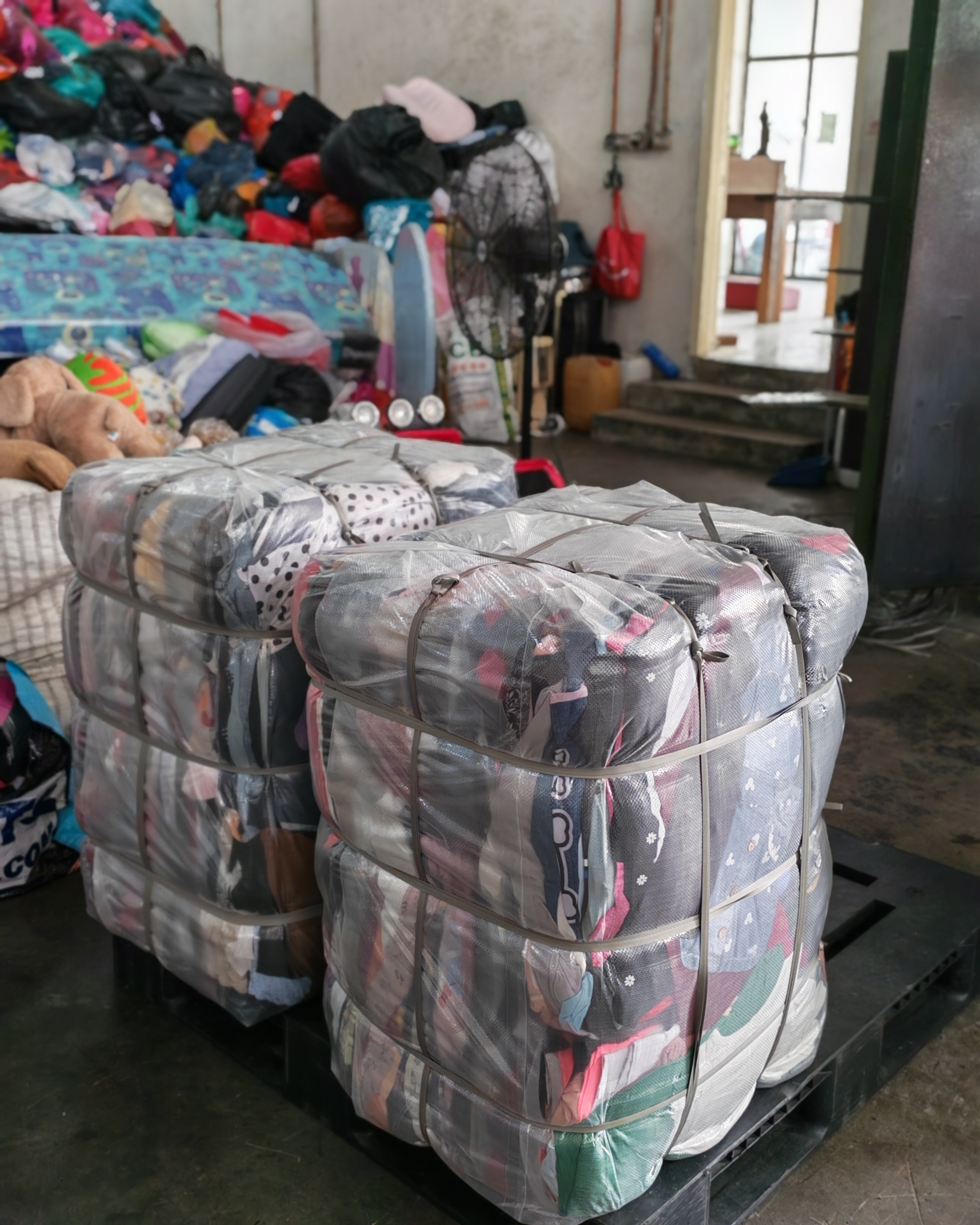 Donated clothing sorted at a collection centre